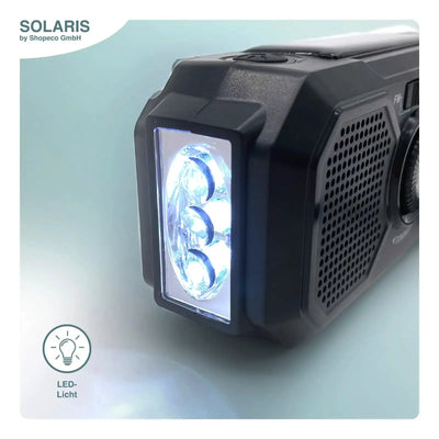 Portable Solaris Tragbares Kurbelradio mit Solarpanel LED-Arbeitsleuchte mit dreiflammigem Design und schwarzem Gehäuse.